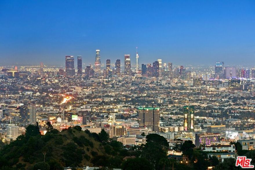 Introducing 2666 Larmar Road, a rare 2.2 acre development opportunity in the iconic Hollywood Hills with mesmerizing city views that stretch as far as the eye can see. This secluded and tranquil property is located on a quiet cul de sac, moments away from the Sunset Strip, Outpost Estates, and West Hollywood's best shops, restaurants, and entertainment. This expansive compound presents endless possibilities for creating a dream estate or magnificent development project, in a premier setting which backs up to Runyon Canyon plus has a private entrance. Take advantage of the chance to own a piece of the Hollywood Hills, immersing yourself in the vibrant energy of Los Angeles while enjoying the serenity of your own private oasis. Please note: renderings are purely design concepts they are not tied to any plans.