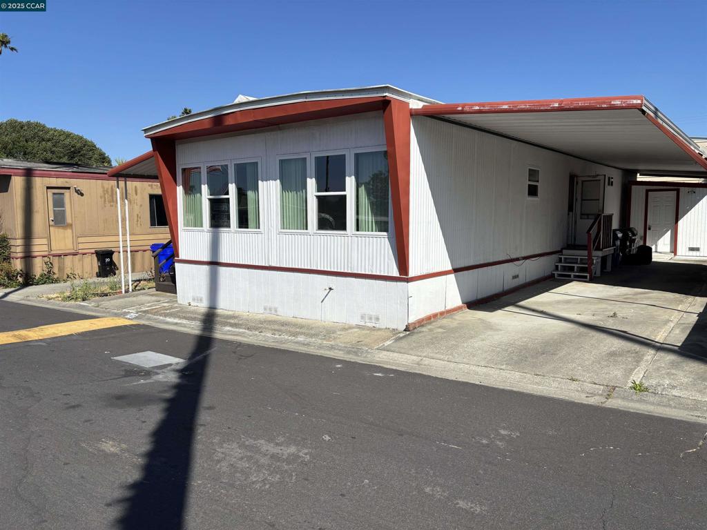 Sunny and Sharp Home In the Tara Hills Senior Mobile Home Park! Upgrades Include Dual Pane windows and Laminate Flooring! Perfect Location Across From the Community Club House and Heated Pool and Spa! Two Bedrooms and Two Baths With a Handy Enclosed Entry Porch For Your Favorite Hobby Activities! Plan to Visit This Home Today! Fireplaces: NO