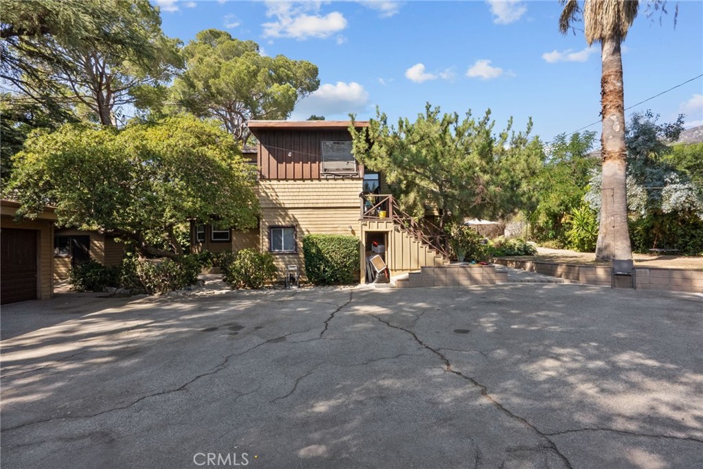 Rare opportunity to own a spacious two-story duplex in one of Tujunga’s most desirable neighborhoods. Sitting on a large 13,419 square foot lot, this property offers 2,443 square feet of combined living space with tremendous upside potential. The downstairs unit features 2 bedrooms and 1 bathroom with approximately 1,143 square feet, highlighted by laminate flooring, a walk-in closet, central air conditioning, wall heater, and an updated bathroom. The upstairs unit is even larger at approximately 1,300 square feet, offering 2 bedrooms and 1 bathroom, a spacious living room, a bonus den currently used as a family room, a kitchen with pantry, and a large bonus closet off the hallway.
The property also includes a detached two-car garage with excellent potential for future ADU conversion, and the expansive lot provides room for the possibility of additional Junior ADUs (buyer to check with city and verify all permit requirements on their own). Each unit is separately metered for gas and electricity, while sharing one water meter. A storage shed with washer and dryer hookups adds extra convenience, and the large driveway offers ample parking for multiple cars. Landlord covers water, trash, sewer and gardener. Tenants pay for their own electricity and gas. Nestled on a quiet cul-de-sac, this fixer-upper is perfect for investors, developers, or homeowners looking for a multi-generational living setup with strong income potential. With its prime location, spacious lot, and incredible opportunities for value-add improvements, such opportunities don't come around that often.