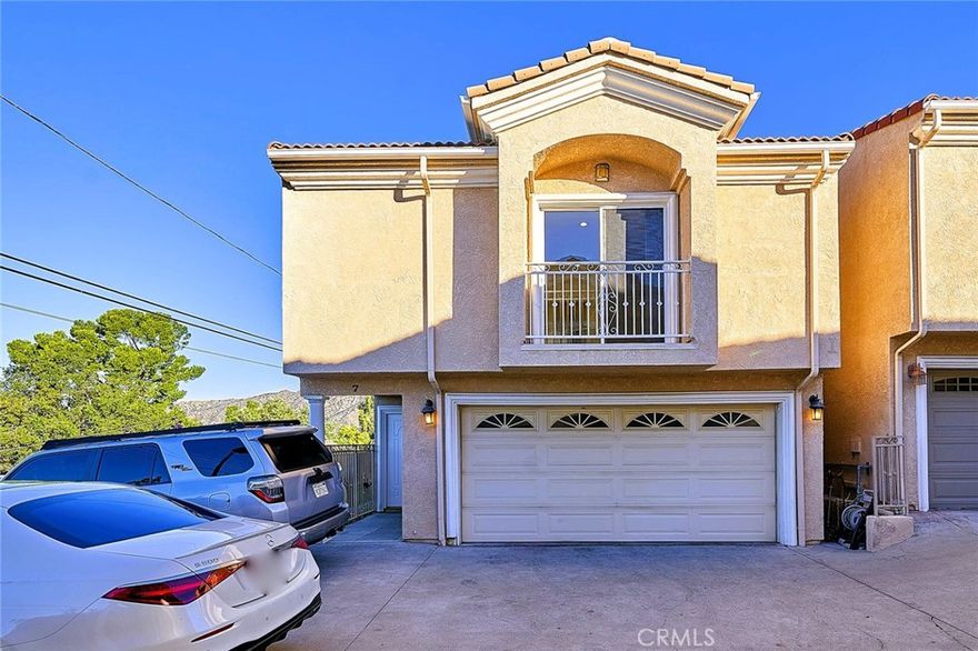 Beautifully remodeled 2-story detached townhome in a highly desirable gated community in Tujunga. This end-unit residence offers 1,643 square feet of modern comfort with 4 spacious bedrooms and 2.5 baths, including a convenient half bath downstairs for guest. The attached 2-car garage and private outdoor area make it perfect for barbecues, entertaining, or simply enjoying the peaceful surroundings of this quiet community.  Step inside to discover a tastefully upgraded interior featuring a brand-new kitchen with elegant cabinetry accented by gold hardware, a generous living room, and stylish finishes throughout. The expansive primary master suite boasts two walk-in closets, each bedroom has closet for extra storage space. This home truly shines with its breathtaking views—depending on the weather, you’ll enjoy vibrant sunsets, and on rainy days, a dramatic fog rolls in, creating a uniquely atmospheric and almost cinematic backdrop. With low HOA fees, modern upgrades, and move-in ready appeal, this property checks every box for comfortable family living. Don’t miss the chance to make this beautiful home yours!.
