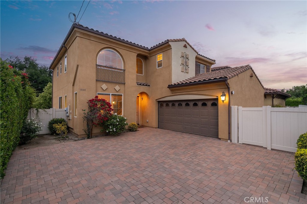 Move-In Ready Gem with Private Backyard in the Heart of Tarzana! Welcome to this beautiful home offering modern living, generous space, and exceptional comfort in a quiet, family-friendly neighborhood. Whether you're a first-time buyer or looking to upgrade, this move-in ready property is the one you’ve been waiting for! Step inside and enjoy a bright, open floor plan that offers contemporary finishes throughout, including tile flooring, recessed lighting, and a fresh, modern color palette. The expansive kitchen is a true highlight, featuring tons of counter space, custom cabinetry, and room to cook, entertain, and gather—a perfect setting for hosting family and friends. The thoughtful layout includes a bedroom and full bathroom on the first floor, ideal for guests, in-laws, or a home office. Upstairs, the spacious primary suite features a dual vanity, large walk-in closet, and a beautifully updated en-suite bathroom designed with both style and function in mind which includes a separate walk-in shower and bathtub. Step outside and unwind in your private grassy backyard, a serene escape perfect for outdoor dining, gardening, or simply enjoying the California sunshine. With plenty of room to play, relax, or entertain, the backyard makes this home feel like your own personal retreat. Additional conveniences include solar panels, laundry located downstairs, making everyday chores a breeze, and a long driveway with plenty of room for multiple cars or RV parking. Centrally located near schools, parks, shopping, dining, and major freeways, this home offers the perfect balance of suburban tranquility and city accessibility. Don't miss your opportunity to own this beautifully updated Tarzana home with all the space and features you’ve been looking for. Schedule your private tour today!