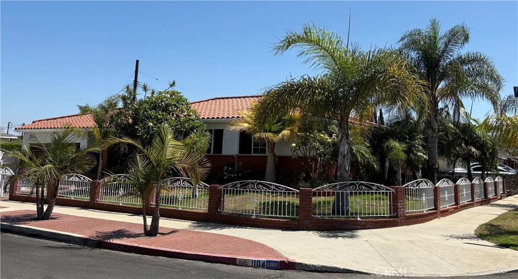 Curb appeal at its finest! This corner lot home, surrounded by palm trees, has California woven into the outdoor flow. Its Spanish-style is blended with comfort and charm, truly a property not to be missed. You can appreciate how exceptionally its been well-kept throughout the spacious open floor plan. The kitchen offers a cozy eating area, unique tile counter tops and custom cabinetry with ample storage space. From the kitchen you can step down to the family room, ideal for those special occasions or step into the inviting living room and entertain your guests. All 3 bedrooms are thoughtfully designed for comfort and privacy and the 2 full bathrooms have been updated with modern fixtures. A generous and secure 2 car garage is seamlessly connected to the home, perfect for daily ease and storage needs. This property is nestled on a 5675 Sq. Ft. Lot, located near major freeways, LA/LB Ports, restaurants, schools and LA Harbor College and Golf Course. Enjoy all of the benefits Wilmington has to offer. Its The Heart of the Harbor. Pictures to follow.