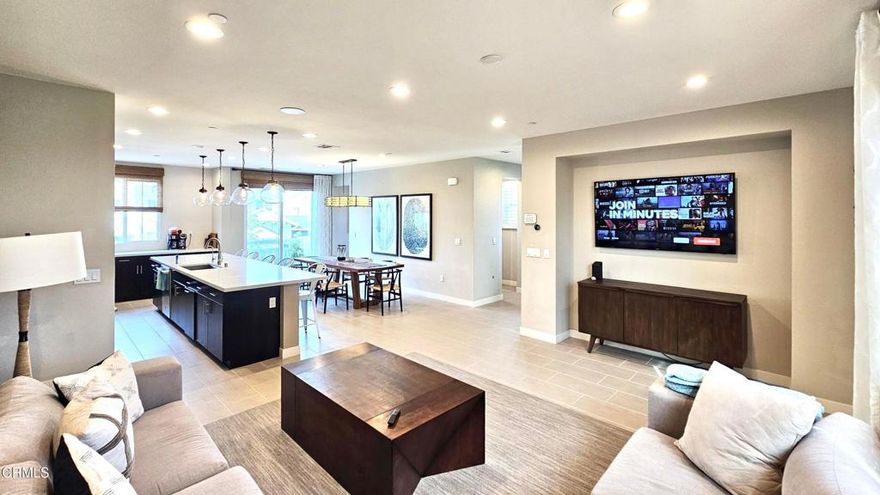 Conveniently located in Goleta and featured as the builder's MODEL HOME with premium upgrades throughout, this townhome is among the very best in Winslowe. This end-unit has one of community's largest fenced and beautifully landscaped backyards. Spacious and tastefully decorated interior--all 2,229 sq ft--defines modern luxury and lifestyle. Family room with built-in wine cooler on 1st floor has accordion sliding doors that open to paved backyard and may be converted to an 2nd primary with bath, per builder. Enjoy 9-ft ceilings, recessed LED lights, and high efficiency double-pane windows. Access apprx. 440 sq ft 2-car garage from interior, where a 200 amp panel is ready for a fast EV charger. Seller-owned Sunpower solar panels will help you save on included electric central heating & AC! Extra large kitchen island great for prepping & entertaining guests. Keep organized with lots of cabinets. Upgraded kitchen appliances. Bonus custom-built office for remote work or dedicated homework space. Control home climate with a smartphone! Current HOA fee is $282/mo and offers: pool & spa, communal gardening, outdoor BBQ, firepit, play and doggie areas, fire pit, bocce court, club house, and community maintenance and more. Noteworthy nearbys: Goleta Beach Park, UCSB, bike paths & trails with ocean views, Camino Real Marketplace (Costco & Target) Calle Real Shopping Center, Goleta Valley Cottage Hospital, Coronado Butterfly Preserve, and restaurants in charming Old Town Goleta.