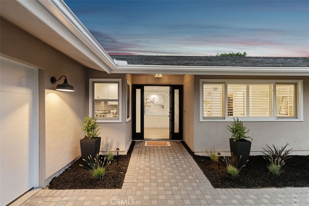 Coastal Elegance Meets Canyon Serenity in Laguna Beach
Perched on a breathtaking canyon side in one of Laguna Beach’s most coveted enclaves, this newly remodeled single-story stunner offers the perfect blend of modern luxury and natural beauty. Taken down to the studs and reimagined with meticulous attention to detail, this 3-bedroom, 2-bathroom residence spans 1,515 square feet on a generous 9,788 sqft lot with stunning ocean, canyon, and city light views.
Step through the charming Dutch front door into a sun-drenched interior featuring floor-to-ceiling windows, new wood flooring, fresh paint, designer hardware, and custom doors throughout. The open-concept kitchen gleams with newly painted cabinetry, sleek quartz countertops, and high-end finishes, flowing seamlessly into the living and dining areas—all framed by panoramic ocean and canyon views.
Outside, the transformation continues with all-new landscaping, a state-of-the-art sprinkler and drip system, water fountain, ambient landscape lighting, and raised garden boxes bursting with fresh vegetables and herbs. Whether you’re entertaining under the stars or enjoying a quiet morning coffee, the outdoor spaces are designed to inspire.
Additional upgrades include updated roof, epoxied garage floors, gutters, and a powerful new AC unit—ensuring comfort and peace of mind year-round.
The large lot backs to a reserve and provides a rare opportunity to add additional rooms, an infinity edge pool, a second story, or a rooftop deck with unobstructed views. Welcome Home Indeed.