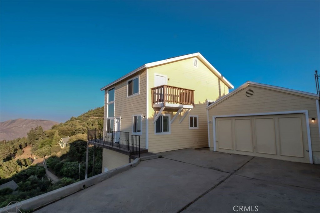 MOUNTAIN VIEWS, PRIVACY, and POTENTIAL in JULIAN! This 2 Bed / 2 Bath Mountain Home with Large Bonus Room and 2 Car Garage. Offers stunning Panoramic Views all the way to the Salton Sea. Located in Kentwood In the Pines. Just 10 minutes from downtown Julian. This 1,320 sqft retreat features a dramatic Living Room with Vaulted two-story ceiling, Fireplace, and Large windows that flood the space with natural light. Second fireplace in the primary bedroom. There is also a Sauna. Recent updates include new paint and flooring throughout. Paid-off Solar System provides energy savings. The spacious bonus room (14x12) is perfect for a home office, gym, or guest space. Great opportunity for buyers looking to add value. This is a handyman special with solid bones and tons of upside. Private setting with lots of usable outdoor space. Room sizes: Living Room 14x13, Dining Room 10x8, Kitchen 8x8, Primary Bedroom 13x12, Bedroom 2 is 12x12, Bonus Room 14x12. Seller has not occupied the property and is willing to Offer Buyer Concessions.