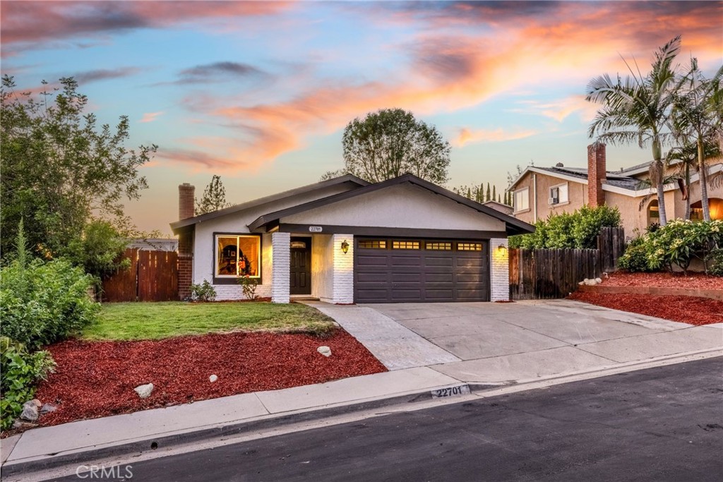 Step into a completely transformed, single-level haven nestled in the heart of Mission Viejo, boasting breathtaking views and an abundance of upgrades. This 3-bedroom residence offers the ultimate in modern comfort, featuring a brand-new AC compressor, HVAC system, attic insulation, water heater, air ducts, and PEX piping throughout. Beyond the stunning curb appeal, highlighted by meticulously manicured landscaping, vibrant paint, and majestic palm trees, discover an extra-wide driveway providing ample RV or boat parking alongside the 2-car garage. Inside, be captivated by the seamless flow of natural light across beautiful laminate flooring and through new double-paned windows. The living room invites relaxation with a charming fireplace and a large ceiling fan. The chef's kitchen shines with pristine white cabinetry, elegant stone tile countertops, and stainless steel appliances. The expansive dining room, ideal for entertaining, features a ceiling fan and a double-paned sliding door that opens to the backyard oasis. Rest assured with bright guest bedrooms, each equipped with ceiling fans. The master suite provides a spacious retreat with incredible westward views. Indulge in the newly remodeled master bathroom, featuring a beautifully appointed walk-in shower. The oversized backyard, offering panoramic city light views, also includes a custom garden and a paved side yard perfect for a small sports court or additional RV/boat parking. This home's prime location puts you at the epicenter of Mission Viejo's vibrant lifestyle with ocean breezes. Enjoy proximity to fantastic parks, top-rated schools, diverse shopping, and exceptional dining options. A short distance away lies the crown jewel of the community, Lake Mission Viejo, providing endless opportunities for recreation and relaxation. This is more than a home; it's a gateway to the best of Mission Viejo living. Welcome Home!