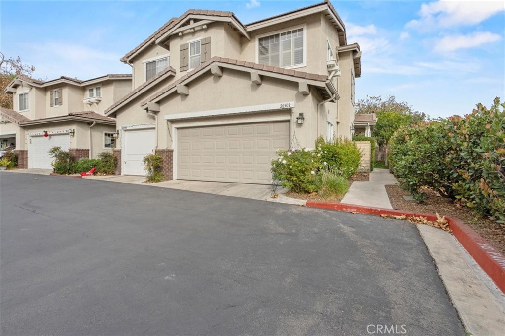 Welcome to the desirable Cheyene Community in Valencia where you'll find this 3 Bedroom and 3 Bathrooms end unit Townhouse in a great location. Hidden at the end of cul-de-sac (right near of abundance guest parking) Offering an exceptional blend of privacy, comfort and entertaining. The open floor plan has a tile flooring through the downstairs and a living room with fireplace, lots of natural light and brightens with open Kitchen has tile counters, appliances and openness through the living room. Mater bedroom with natural light, Plantation shouters through the house, master bathroom with double sink, walking closet and wood floors. Two additional rooms for guest and office space for work. One bathroom in the downstairs for your convenience, and for your guest. Attached two car garage and laundry area. Central A/C and Heater. The community is incredible with a lot of green areas, community pool and spa, playground area and more. Close to everything, shops, transportation, restaurants and coffee shops. Situated in the highly sought Northbridge community, this home is within walking distance to parks, top rated schools, churches and shopping, both lifestyle and location in one exceptional package.