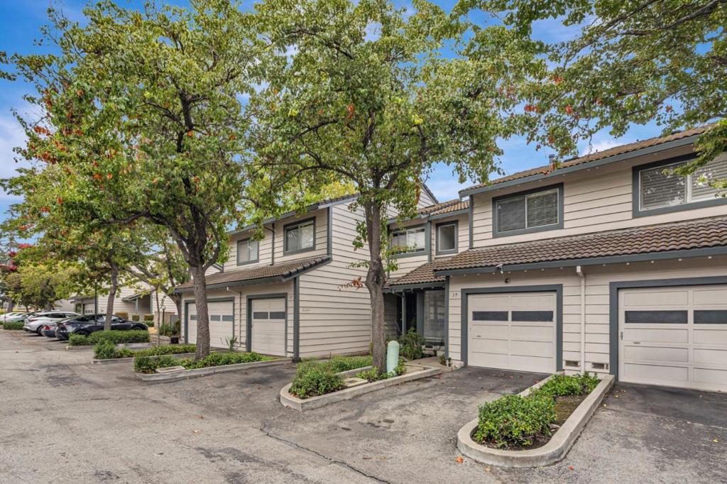 Welcome to this rare opportunity to own or invest in a charming townhome with PUD ownership, located in the serene and highly desirable Cardoza Park neighborhood in Milpitas. This beautifully maintained home features an open-concept floor plan filled with natural light, perfect for modern living. Enjoy two spacious ensuite bedrooms, freshly painted interiors, newly upgraded flooring, and large windows that enhance the airy, inviting atmosphere. The living and dining area opens through a sliding glass door to a low-maintenance private backyard, ideal for relaxing or entertaining. Just minutes from Cardoza Park and the Milpitas Sports Center, offering amenities like swimming pools, tennis courts, football and baseball fields, and soccer pitches. Nestled near scenic hills, this home offers a tranquil escape with miles of nearby walking trails, perfect for nature lovers, hikers and outdoor enthusiasts. Commuters will love the easy access to Highways 680, 880, CA-237, and BART, as well as the home's proximity to major tech companies. Nearby you'll also find shopping malls, grocery stores, restaurants, parks, and a golf club, everything you need just around the corner. Open House: 9/20, 21 at 1:30-4:30PM.