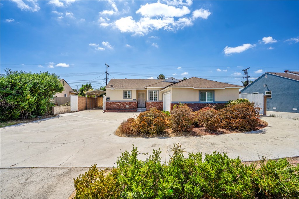 Two Homes on One Lot – Ideal Investment or Multi-Generational Living! This lot features a spacious main home with 3 bedrooms, and 1.5 bathrooms, plus a permitted ADU with a separate address, offering 2 bedrooms and 1 bath, is fully independent, providing modern living space with its own entrance, kitchen, and laundry hookups. —perfect for rental income, extended family, or guest accommodations. Enjoy comfort and efficiency FULLY PAID OFF SOLAR system helping with energy savings. Your property includes Double Gated RV Parking, a spacious driveway, accommodating up to 8 vehicles, perfect for entertaining or growing families. Its prime location offers unparalleled convenience, with proximity to numerous grocery stores, restaurants, and easy access to Freeways 5 and 22. Delight in a short 6-7 minute drive to the magic of Disneyland or explore the vibrant community of Little Saigon, just 10 minutes away. This property is more than just a home; it's a lifestyle of convenience, opportunity, and impressive potential income. Don't miss your opportunity to own an incredible piece of Garden Grove city!
