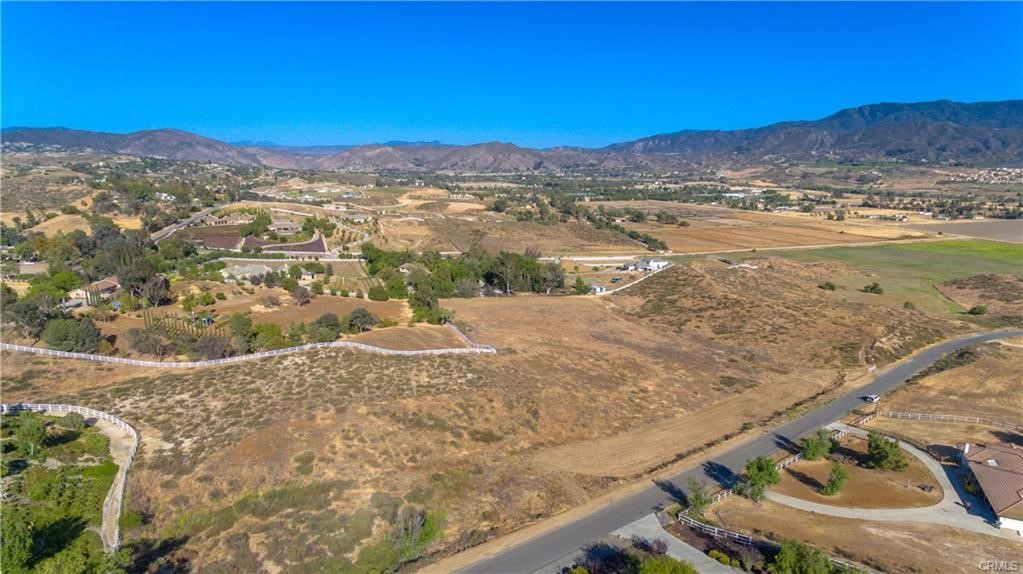 Beautiful 5.02 all-usable acres located in the exclusive Country Road Estates—one of Temecula’s most prestigious custom home communities. This prime parcel sits among luxury estates on fully paved roads with utilities at the street, offering a seamless start for your dream build.
Enjoy the perfect blend of peaceful country living and close-to-town convenience—just minutes to shopping, dining, schools, and Temecula’s world-renowned wineries. The gently contoured land provides multiple options for your custom estate or spec home, surrounded by scenic views and elegant neighboring properties.
A truly exceptional opportunity to build in one of the area’s most sought-after neighborhoods where pride of ownership and quality craftsmanship shine throughout.