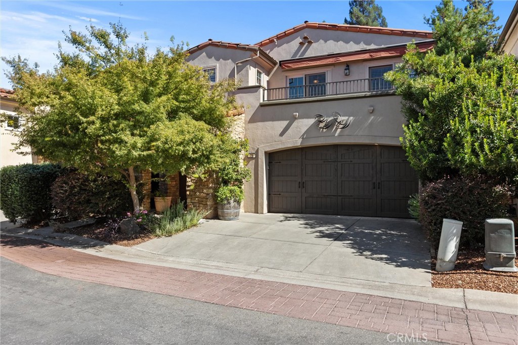 This meticulously maintained executive home offers luxurious living with high-end amenities. Enjoy custom Cherry Wood Cabinetry, granite countertops, and solid core doors with beautiful levered door handles, and architectural archways. Soaring ceilings add to the feeling of spaciousness, and Solartubes fill the rooms with abundant natural light.
This property offers sophistication with the convenience of low maintenance.
The living room features a tall ceiling, a cozy fireplace, and 2 French doors opening onto the back patio, which is an excellent space to entertain with a built-in counter, custom awnings and ceiling fans.
Gourmet kitchen features custom cherry wood soft-close cabinetry, Venetian Gold granite slab counters, stainless steel appliances, a large island with a breakfast bar, and reverse osmosis drinking water.
The primary suite offers a private retreat with direct access to the back patio. It features high ceilings and an oversized walk-in closet. The en-suite bath has a lavish tile-surround soaking tub, a convenient step-in shower with inlaid Tuscan tile, and a dual-sink vanity featuring stunning granite and a beveled mirror that perfectly complements the space.
The second-story landing, currently featuring a desk that is included in the sale, offers versatile space perfect for a yoga, a stationary bike, or a quiet reading nook.
Two additional bedrooms are upstairs, one of which boasts a large walk-in closet. Both bedrooms offer sliding glass doors that open to a shared balcony, perfect for enjoying your morning coffee.
The upstairs bathroom has been upgraded with a spacious step-in shower featuring a smooth pebble floor, modern glass front, and beautiful granite surround. A large beveled mirror with updated light fixtures complements the area above the dual-sink vanity, which is accented by a decorative herringbone backsplash.
Please ask your Realtor about updates, which include: HVAC, ROOF, WATER HEATER, etc