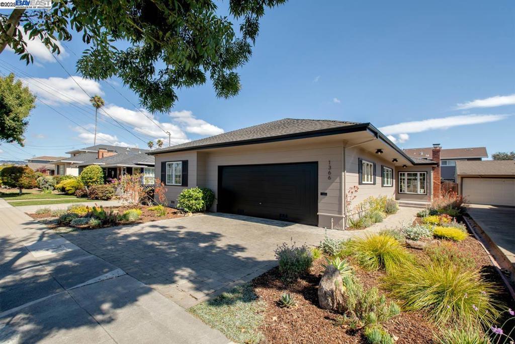 Built in 1953, this recently updated single-level ranch-style home is located in the East End's close-knit East Shore HOA community close to both Lincoln Park and the San Leandro Bay shoreline. Just 2 blocks long between Encinal and Central avenues, Hansen Ave is a cozy enclave of homes built between 1950 - 1960 and now valued for their authentic mid-century aesthetic. Owned by only two families since 1953, this pristine home features three bedrooms, two bathrooms, a living/dining room combination, eat-in kitchen, an attached 2-car garage and a family room that easily can be used as a spacious primary or 4th bedroom. Updates include refinished oak floors and new light fixtures throughout, fresh interior/exterior paint, and a kitchen with new appliances, butcher block counters and attractive luxury vinyl flooring. The main entrance on the side of the home provides optimal privacy, while new native landscaping (2024) creates wonderful curb appeal in the front and a pretty, low-maintenance garden in the rear. This desirable East End location offers close proximity to Encinal Market, the South Shore Center, Park Street's many amenities and top-rated schools. Just minutes to freeways, OAK and the SF Ferry. A rare offering in this sought-after neighborhood!