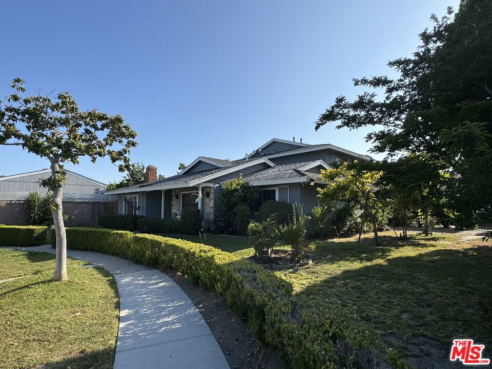 Placed perfectly at the end of a well-maintained and quiet street, this spacious, fully renovated home awaits its next occupants! Located in the heart of Anaheim, this home boasts a plethora of features. The high ceilings and roomy entranceway welcome you inside, where you'll find a spacious living room that leads you to the brand new kitchen, freshly installed with top of the line appliances, including a washer and dryer. As you continue down the hall, you'll step into your primary bedroom with a large closet, attached bathroom, and natural light beaming. You'll also find two additional bedrooms, each with walk-in closets, and a second updated bathroom. The side patio off the kitchen and the expansive yard are ideal for relaxing or entertaining, with ample shade and an abundance of open space. A full, two car garage supplies extra storage, and combined with an additional parking space and plenty of street parking, there is plenty of space to entertain! Just minutes to Anaheim's popular attractions Knott's Berry Farm and Pirate's Dinner Adventure, as well as delicious restaurants like Thirty Acres Farm, Rock & Brews, and Claim Jumper. Convenient shopping nearby as well with grocery stores, Target, Home Depot and more all just a short trip away. This home has it all. Come see for yourself!