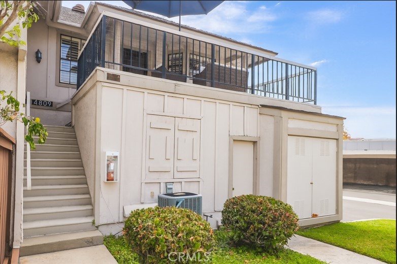 Tucked quietly in the back of the desirable Influential Townhomes community, this updated and well-appointed 2-bedroom, 1-bathroom condo offers an ideal blend of privacy, comfort, and convenience in the heart of Cypress. The living room features laminate wood flooring, a cozy fireplace, and a built-in wet bar—perfect for entertaining. The updated kitchen is equipped with recessed lighting, a gas range, microwave, dishwasher, and refrigerator, offering both functionality and style. The primary bedroom boasts a private vanity area and a spacious walk-in closet, while the full bathroom offers jack-n-jill doors for convenience. separate indoor laundry room adds practicality to daily living. Carpeted bedrooms ensure a soft and quiet retreat. Enjoy central heating and air conditioning throughout the home, and soak in the serene neighborhood views from your private rooftop balcony where you will experience the West/East breeze—an exclusive escape just for you. Additional features include a one-car garage below the unit and an adjacent covered carport space for added convenience. Located toward the rear of the complex, the home offers enhanced privacy and a sense of calm away from street traffic. The Influential Townhomes community includes resort-style amenities such as a sparkling pool, soothing spa, and BBQ area—all set within lush green landscape. Added value it is located in the top-rated Cypress School District as well as centrally adjacent to shopping, dining, and entertainment. This home offers smart living in a in a fabulous community that truly has it all.