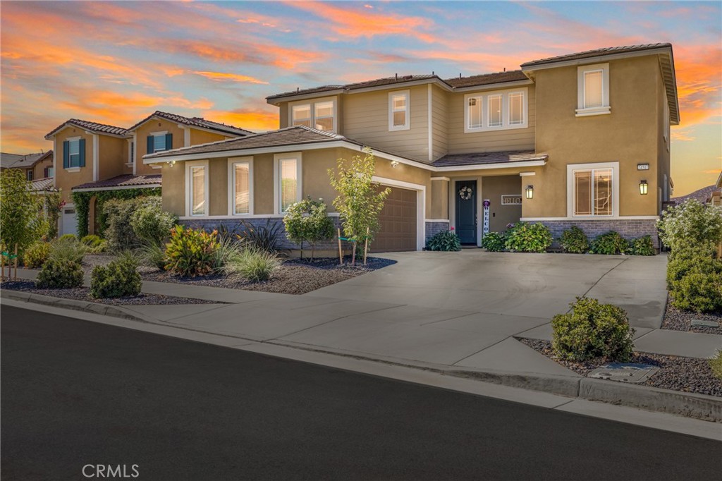When it comes to modern living this is the one! With upgrades galore, 6 bedrooms, 4 bathrooms, OWNED solar, and an above ground spa, this home literally has it all! The 2021 built Richmond American home features white and black finishes, on a cul-de-sac and is located in the highly desirable community of Audie Murphy Ranch in Menifee, within feet of the new Kathryn Newport middle school. The front curb appeal offers drought tolerant landscaping, and a cozy porch with stunning mountain views. Inside the home you are greeted by soaring 30 foot ceilings, LVP floors and a desirable floor-plan offering 2 main floor bedrooms. The first bedroom is appointed with upgraded carpet, a black wood accent wall and offers a full bathroom boasting a single vanity, and shower-tub combo. Across the hall is a large, long room that offers three built-in desk spaces and custom built-in cabinets, which is perfect for an office or flex space! The two car garage offers EV charging capability and the whole house filtration system and water softener. The large Great Room offers the most beautiful custom electric fireplace in a black shiplap inset surrounded by custom cabinets. The dining area is large enough for a huge farm table and flows into the chefs kitchen. This space is appointed with granite counters, an eat-up island, honeycomb backsplash, black pendant lighting, stainless steel appliances including a new dishwasher, double oven, 5 burner stove, RO water filtration system, and walk-in pantry. The grand staircase features a custom black chandelier, wood accent wall and upgraded carpet. The second story boasts a whole house fan, 3 large secondary bedrooms with one offering a walk-in closet and the other room acts as a junior suite with it's own full attached bath. The others share a full secondary bath. The large laundry room boasts a built-in folding table and storage. The Primary suite is appointed with a custom electric fireplace surrounded by shiplap and a floating mantel, a wood accent wall and beautiful barn door that leads into the primary bath featuring quartz counters, a quartz lined shower and tub and a large walk-in closet. The romantic yard is appointed with a large aluma wood patio cover with recessed lighting and ceiling fans, concrete for entertaining, artificial turf, many different fruit trees, a rose garden and secret garden oasis. The community offers a club house, pools, spa, skate park, trails, sports parks and the award winning Taawila ES.