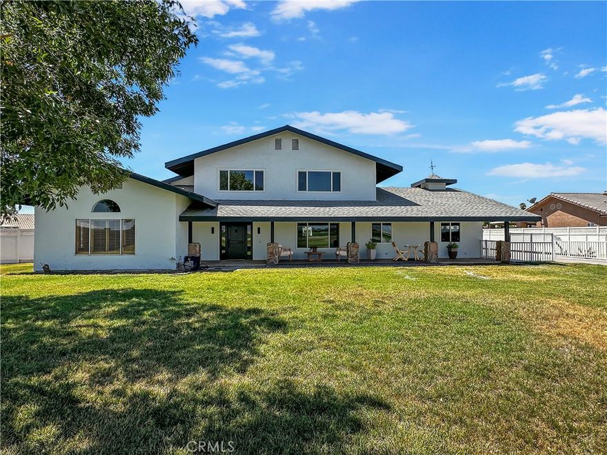 Discover your dream retreat at 650 W 10th Ave, Blythe, CA 92225—a stunning, fully remodeled 4-bedroom, 3-bathroom custom home nestled on a serene 1-acre lot with breathtaking mountain views and tranquil farmland across the way. This move-in-ready masterpiece blends luxury and comfort, featuring high-quality luxury vinyl plank flooring, a gourmet kitchen with white shaker and white oak cabinetry, a spacious island, induction stove, and dishwasher, and two cozy fireplaces—one in the inviting living room with built-in bookshelves and another off the kitchen. The downstairs primary suite offers private exterior access, a curbless shower, and a walk-in closet, while the upstairs primary suite boasts a lavish walk-in shower with three showerheads, a double sink vanity, and another walk-in closet. With an attached 2-car garage equipped with an EV charger, a detached 3+ car garage with a 50-amp RV plug, and a stackable washer/dryer included, this home is designed for modern living. Perfectly blending sophistication and peaceful rural charm, this one-of-a-kind property is ready for you to call home.