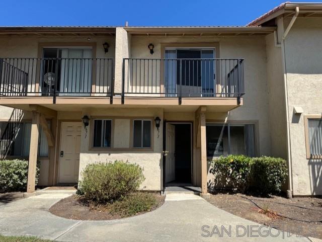 Adorable 2BR/1.5BA Townhouse with Garage in Prime Location! Move-in ready and full of charm! This beautifully maintained townhouse features 2 bedrooms, 1.5 bathrooms, a 1-car garage plus an additional parking space. The kitchen boasts granite countertops and opens to a cozy patio — perfect for outdoor dining or relaxing. Downstairs features newer vinyl flooring, while upstairs offers spacious bedrooms with ceiling fans, including a large primary suite with its own private balcony. Additional highlights include a brand-new side garage door and water included in the rent. 1 additional parking space. Located in a highly desirable community with fantastic amenities: enjoy access to a pool, spa, and playground. Conveniently close to shopping, dining, and major freeways.