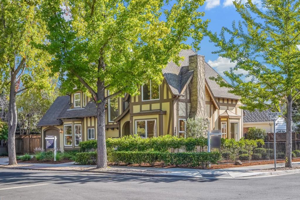 Welcome to this charming English Tudor-style home, nestled in the heart of the highly sought-after Old Palo Alto neighborhood. Surrounded by elegance and character, this custom-built residence invites you in with its enchanting iron fence and beautiful picture windows. Inside, you'll find high ceilings and 8-foot interior doors that create a sense of spaciousness and comfort throughout the main level. The bright first-floor bedroom offers a perfect spot for a home office or guest room. Upstairs, the luxurious master suite and two additional bedrooms provide a peaceful retreat, while the lower level offers two more bedroomsgreat for family, guests, or added privacy. The basement also features a generous area for games, movie nights, or entertaining friends. Located near lovely parks and some of the areas top-rated schools, its an ideal setting for families. Plus, you're just minutes from fine dining, shopping, golf courses, commute routes, and the natural beauty that defines Silicon Valley living.