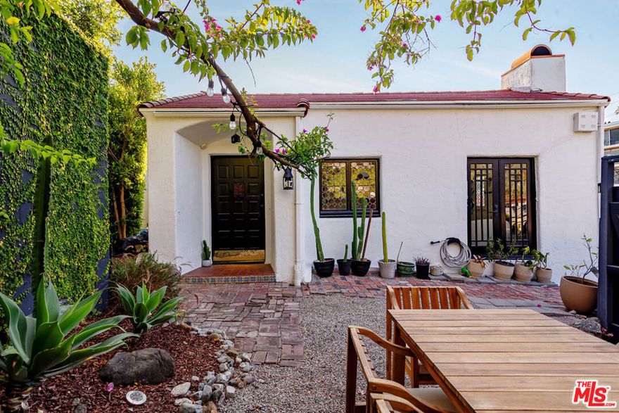 Opportunity of a lifetime to own a piece of Hollywood history! Welcome to "Casa Casablanca", a 1920s Spanish cottage that transcends time high above the boulevard in Whitley Heights, steps from the Hollywood Bowl. This masterpiece was meticulously designed by  Oscar-winning art director Carl Jules Weyl, famed for bringing cinematic masterpieces like "Robin Hood" and "Casablanca" to life. This 2-bedroom, 2-bathroom treasure offers a blend of historical elegance and modern convenience. As you step in through a gated courtyard patio, inviting manicured grounds welcome you to this stunning Spanish cottage. Inside, vaulted beamed ceilings soar above intimate spaces, casting light through whimsical bottle glass stained windows, skylights, and archways. The 1,133-square-foot interior features exquisite details, including built ins, moldings, and a sunken bathtub that invites relaxation. Open the balcony doors to enjoy a breath of tranquility overlooking the lush lower yard, your personal retreat amidst the vibrant city life. This home offers essential modern amenities like air conditioning, washer/dryer, Bosch refrigerator & dishwasher, Viking stove, and two remodeled bathrooms. The residence's multiple private outdoor spaces offers the perfect canvas for your personal touch with views of the hills. Located in the heart of Hollywood in Whitley Heights, you are walking distance to the iconic Hollywood Bowl and a stroll up to the Hollywood Reservoir. Bordering Hollywood Dell, this location is accessible to the best Hollywood has to offer with convenient freeway access. Peekaboo views of the Hollywood Sign are visible from the front door. Permitted street parking only in front of the property. Offer deadline is on Monday 10/20 by 1pm. Only showings available are within the following time frames: 10/13 from 3-4pm. 10/15 from 2:30-4pm. 10/17 12:30-2pm. 10/18 & 10/19 from 1-3pm. Seller reserves the right to accept an offer prior to offer deadline.