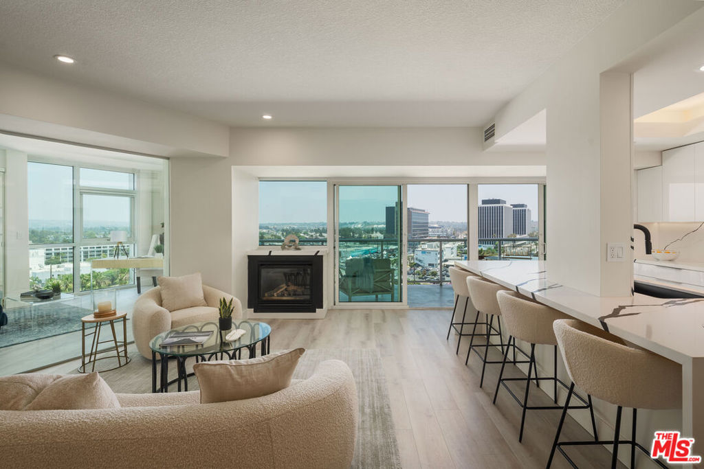 Discover luxury living in this newly remodeled private corner unit at the prestigious Regatta Seaside Residences. Featuring a rare 3-bedroom floor plan, the only layout of its kind in the building, this residence showcases contemporary elegance with stylish flooring, custom quartz counters, ivory cabinetry, and premium Thermador appliances, including a designer refrigerator, onyx-hued sink, and wine cooler. Floor-to-ceiling windows illuminate the interior, seamlessly connecting to an oversized balcony with natural gas BBQ hookups and breathtaking views of the city, mountains, and marina. The master suite includes abundant closet space, highlighted by an additional custom-designed closet perfect for shoe collections. The spa-inspired master bath offers Italian quartz surfaces, ambient LED lighting, and an expansive double shower with European fixtures.Residents enjoy resort-style amenities: heated saltwater pool, spa, sauna, fitness center, and screening room, plus 24-hour concierge and valet services. Ideal for those seeking a vibrant coastal lifestyle, this unit blends sophisticated comfort and exceptional entertaining potential overlooking the marina.
