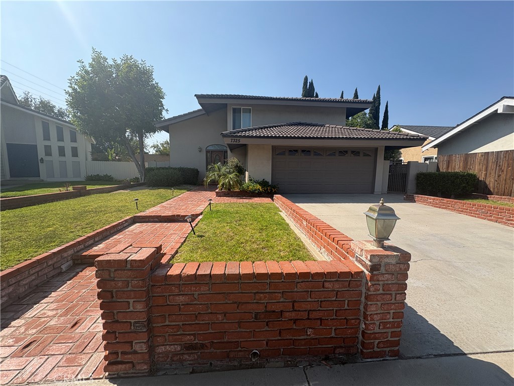 Beautifully updated two-story home located at the end of a peaceful cul-de-sac in Anaheim Hills. This 3-bedroom, 2.5-bathroom residence offers approximately 1,662 square feet of living space on a generous lot. An extra-long driveway and brick walkway lead to the inviting entry.
The interior features brand new flooring, updated ceiling light fixtures, and vaulted ceilings in the spacious living room. A separate formal dining room and a cozy kitchen dining area with a fireplace and wood mantel offer ideal spaces for everyday living and entertaining. The kitchen includes a breakfast bar, tile countertops, and newer cabinetry.
The upstairs hall bathroom has been updated with a Jacuzzi tub, decorative tile surround, and tile flooring. All bedrooms include ceiling fans, and the primary suite features a fireplace, built-in storage, dual closets, a vanity area, and a walk-in shower.
Additional highlights include newer dual-pane windows, fresh interior paint, a two-car garage with direct access, epoxy flooring, built-in cabinetry, and a workbench. The landscaped backyard with a wood patio provides a relaxing outdoor setting.