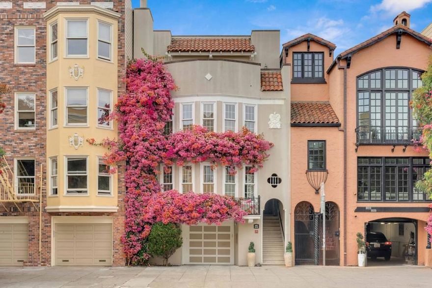 3219 - 3221 Gough Street is a distinguished two-unit building, ideally situated just half a block from Fort Mason and the San Francisco Bay. Showcasing elegant architectural details such as gleaming hardwood floors, abundant natural light, and classic crown molding, this property offers timeless charm and functionality. The top unit offers, 3221, a spacious residence features 3 bedrooms and 2 bathrooms, including a large primary suite. The main level offers a warm and inviting living room with a wood-burning fireplace, which seamlessly connects to a formal dining room. The eat-in kitchen, along with two bedrooms and one bath, complete this level. Upstairs, a generous family room opens onto a lovely private deck, adjacent to the expansive master suite. Enjoy stunning views of the Golden Gate Bridge from the dramatic rooftop deck. The lower unit is a charming unit includes 2 bedrooms and 1.5 bathrooms, showcasing the same refined architectural features. Additional highlights of the building include a quaint studio, plus access to a landscaped yard and patio. The property also includes 3-car parking, making it a rare and desirable opportunity in a prime San Francisco location.