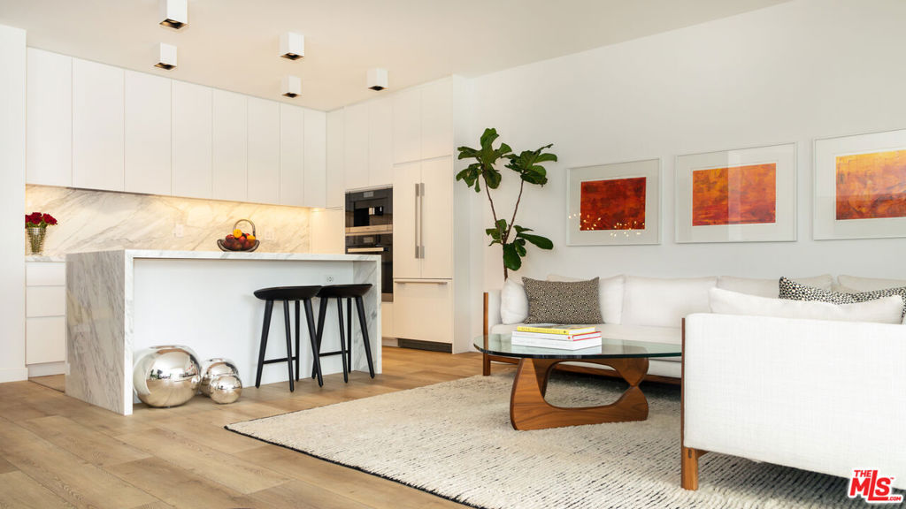 A rare opportunity to own in West Hollywood's most sought after full-service buildings. Located in the prestigious Doheny West Towers is this stunning, recently remodeled, one-bedroom residence offered fully furnished. This exceptionally bright and airy west-facing unit features an expansive open floor plan with a spacious living room, dining area with an adjacent built-in office, and a chef's kitchen with Miele appliances and Calacatta countertops and island. The bedroom has a built-in closet, automatic shades, and direct access to the 35-foot balcony with city/tree-top views. High ceilings and hardwood floors throughout. The full-service building just completed an $8M+ renovation and has a 24-hour concierge/doorman, security, complimentary valet for guests, saltwater pool, gym, sauna, and laundry facility. It was located in the trendy West Hollywood/Beverly Hills area with close access to some of the best restaurants, shops, and hotels. Furnishings by Knoll, DWR, RH, Herman Miller, and several other designers.