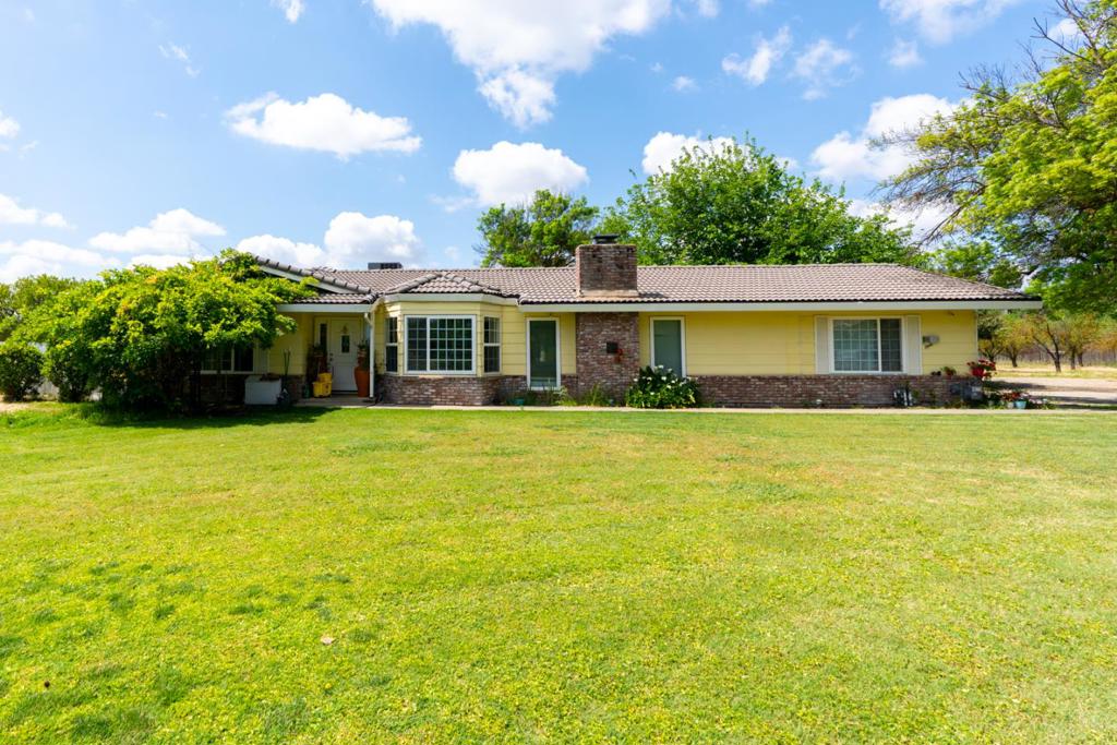 Welcome to this charming home ranch - style in Merced, offering a perfect blend of comfort and functionality. Sprawling state over 1,848 square feet, this residence features 3 spacious bedrooms and 2 full bathrooms. The heart of the home is the kitchen, seamlessly integrated into a kitchen/family room combo, providing a versatile space for both daily living and entertaining. Enjoy meals at the breakfast bar or in the designated dining area within the family room. The home is equipped with Central AC and Central Forced Air heating, ensuring year-round comfort. The flooring throughout the house is designed for both style and durability. A cozy fireplace adds warmth and ambiance to the living space. Practical amenities include a 2-car garage converted in private living unit permits unknown. Located within 6 mins to Merced University, this home offers Additional rear unit permits unknown This two level unit ensures privacy for both guess or tenants. With a generous lot size of approximately 75,829 square feet, with plenty of almond trees, space for horses and outdoor living, solar panels a smart and essential investment now this days. This home is on a natural gas (one of a hand full in this area) Covered patio with brick outdoor type kitchen BBQ and much more worth look to explore