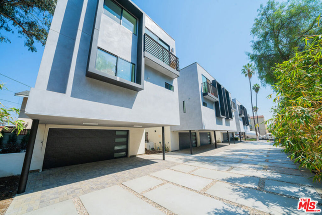 739 N Mariposa Ave | Los Angeles, CA 90029 Turnkey, non-rent-controlled investment ideal for a 1031 exchange delivered vacant and stabilized at a 6% cap rate. Built in 2020, this contemporary green-certified luxury five-plex offers approx. 9,454 sq. ft. of living space and presents investors the rare opportunity to step into a brand-new, cash-flowing asset in one of LA's fastest-growing neighborhoods. The property features five townhouse-style homes, each thoughtfully designed across three stories with private two-car garages, open floor plans, and abundant natural light from floor-to-ceiling windows. Modern kitchens are equipped with high-end stainless steel appliances, gas ranges, dining islands, and white quartz countertops, while luxe bathrooms feature custom tile and designer finishes. Each unit offers 3 bedrooms and 3 bathrooms, including a flex-room on the main living floor, plus in-unit laundry and central air. The entire property is gated with controlled access, security cameras, and separate utility meters for water, gas, and electric plus an owner's meter for exterior and irrigation. With no deferred maintenance, investors can plug directly into stable income while enjoying the flexibility of a vacant delivery. Ideally located minutes from DTLA, Silver Lake, and Hollywood, the property sits in the center of major new development and revitalization, surrounded by mixed-use projects, creative offices, and institutional anchors like Netflix, Sunset Gower Studios, and Kaiser Permanente's expansion campus. This is a rare chance to acquire a 9,454 sq. ft., new-construction luxury multifamily asset with immediate income, growth potential, and prime positioning in one of Los Angeles' most exciting submarkets.