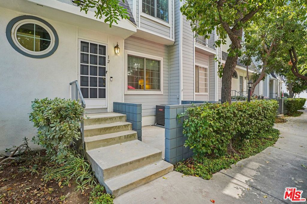 Exceptionally remodeled townhome in the Belmont Townhomes complex. Perfect location with guest parking nearby and easy access to the pool/spa area. Thoughtfully redone with new luxury vinyl flooring and paint. This home is ready for its new owner and new memories to create. Two primary suites upstairs featuring ensuite baths make for easy living. A huge 2-car garage with direct access and your own laundry area downstairs. This complex offers a sparkling pool and a comfortable spa in a gated community. Come see, come buy!