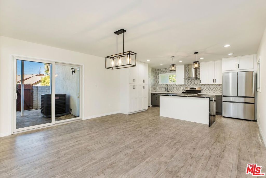 Photo of 9511 Mclennan Avenue, Northridge, CA 91343 (MLS # 25602969)
