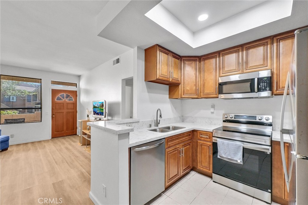 ***Value Range Price $548,000-$588,000***. Must see this 2 bedroom 2 bathroom single level condo in the Hills of Orange with direct access 1 car garage. Excellent premium interior location facing greenbelt with no neighbors in front. Remodeled kitchen with stainless steel appliances, gorgeous countertops and cabinetry. Other great features include remodeled bathrooms, mirrored slider closet in primary bedroom, full size indoor laundry closet & private front entrance with patio. Resort style pool & spa and barbecues and there is another separate pool and spa location for Canyon Glen residents with short walk. Water/trash included with dues. Peaceful living in the Hills Of Orange yet excellent central location. Enjoy walk paths and hiking trails right across the street. Convenient access to toll roads, Peter's Canyon, Irvine Regional Park and 55/91 freeways. Best of all, no Mello Roos taxes. You are going to Fall in love with this one!