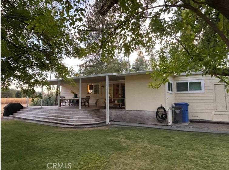 Welcome to your own private oasis in rural Kelseyville close to town & the lake. This property offers many opportunities whether you want to raise livestock or simply enjoy the view while sipping your drink of choice relaxing by the pool. This 3 bedroom 2 bath home has been meticulously maintained showing pride of ownership featuring double pane windows & laminate flooring. The kitchen has double ovens & a built-in cooktop with a large overhead fan/light, dishwasher & plenty of cabinet space including an area for you to enjoy a cup of coffee while looking out at the pastures & mountains.
A separate dining room off the kitchen will accommodate family meals while you make cocktails in the adjoining wet bar. The spacious primary suite features built-ins & mirrored closet doors, the primary bath offers a large built-in vanity with double sinks, ample cabinet space and a walk-in stall shower. The second bedroom is good size and has an adjoining bath with a built-in vanity & sink plus a stall shower. The third bedroom could serve as an office. Park like grounds surround the home & barn with plenty of room for RV's & boat storage & solar panels. The barn has a good size workshop & room for vehicles. Fruit trees include Golden Delicious Apples & Marbella Plums. The entrance to the property features a Gabion basket rock wall.