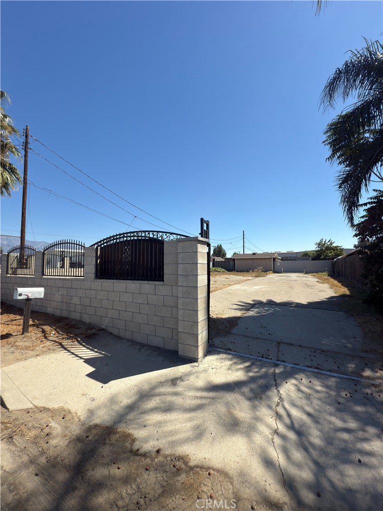 10735 Vernon Avenue, Ontario, CA 91762 offers a central location with convenient freeway access. The property is zoned IC (Community Industrial) under the County of San Bernardino, allowing for light industrial, wholesale, and warehouse services, as well as incidental commercial uses and ADUs. The site includes a front building with a home-style structure in need of some TLC, attached to a steel building. At the rear there is an additional steel structure of approximately 2,900 sqft with a 10 foot roll up door and 14 foot interior clearance, suitable for storage, workshop, or light industrial use.