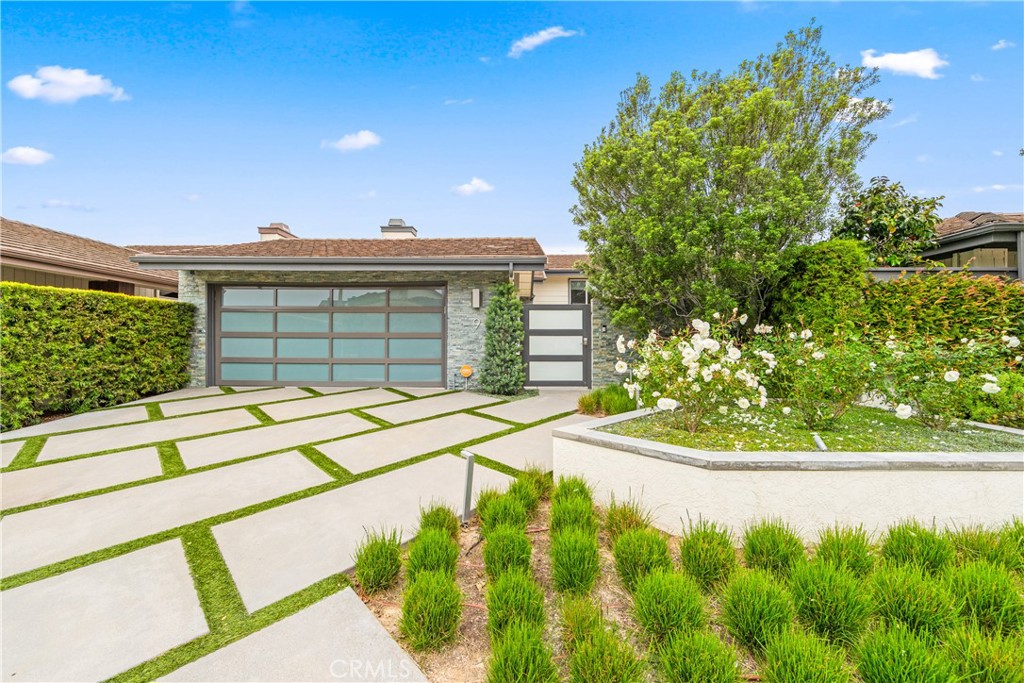 Stunning Ocean, Catalina, and Canyon Views in the Heart of Corona del Mar
Discover a truly spectacular property that seamlessly blends luxury, comfort, and amazing views. Situated within the prestigious, Guard-gate Jasmine Creek community, this stunning home boasts beautiful views of the Pacific Ocean, Catalina Island, and the serene canyon below. Privacy is paramount, with lush trees and greenery framing the property, while the ocean sparkles in the distance.
Step inside to find a beautifully upgraded interior that combines modern elegance with functional design. Rich light oak wood flooring, LED recessed lighting, and tasteful fixtures throughout create a warm, inviting atmosphere. Newer windows and sliding glass doors allow natural light to flood the space, highlighting the stunning views from the living room and primary bedroom decks.
The chef-inspired kitchen is a showstopper, featuring white shaker cabinets, gleaming quartz countertops, and high-end stainless steel appliances, including a Italian 5-burner stove, LG refrigerator, a brand-new dishwasher, a large walk-in pantry for all your culinary needs.
Upstairs, the spacious primary suite offers the ultimate retreat, with breathtaking canyon and ocean views from your private balcony perfect for a quiet morning coffee or a sunset evening. The suite includes a cozy gas fireplace and a luxurious en-suite bath, with dual vanities, quartz countertops, a large walk-in shower, and a custom-built closet with ample storage. Two additional bedrooms provide space for family or guests, each offering comfort and privacy. The home’s open floor plan is ideal for entertaining, with a seamless flow from the living room to the sitting area and dining room. A built-in wine fridge and additional storage create a stylish yet functional space. A versatile bonus room can easily be used as an office, playroom, or home gym. Additional highlights include a finished 2-car garage with extra built-in storage, a beautiful turf driveway with grass block pavers, and lush landscaping that enhances the home's curb appeal.Ring door bell gate
Jasmine Creek’s exceptional amenities include a charming clubhouse, 6 tennis courts, 3 swimming pools, and meticulously maintained parks, all within walking distance. Best of all, the village and beach are just a short stroll away, making this an ideal location for coastal living.
This is your opportunity to own a one-of-a-kind home in one of Corona del Mar’s most coveted neighborhoods.