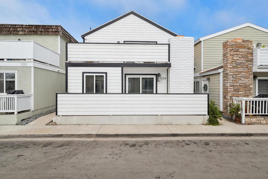 Welcome to your Dream Coastal Investment!  This beautifully Maintained and Updated Duplex is one Block from the Beach!  The Upper Unit is Completely Remodeled with Open Floor Plan, Vaulted Ceilings, Living/Dining Space with Fireplace, 3 Bedrooms, 2 Full Baths with Jacuzzi Tub in each, Stack LAUNDRY, A/C and TWO LARGE BALCONIES featuring Wetland, Mountain and Ocean Views!!!   The Lower Unit has Newer Laminate Flooring and Mini-Spilt in all Living Areas and Bedrooms along with a Spacious Enclosed Patio off Great Room and Full Sized Laundry in Garage. Abundance of Parking with a 4 CAR GARAGE + 1 Space CAR PORT.  Seller Replaced Siding and Stairs.  Generate Income as a Highly Desirable Long Term Rental and if you are going for the big money this can be Vacation/Short Term Rental with Proper City Permit. Walking Distance to Restaurants and Quick Access to Newport and Huntington Beach.