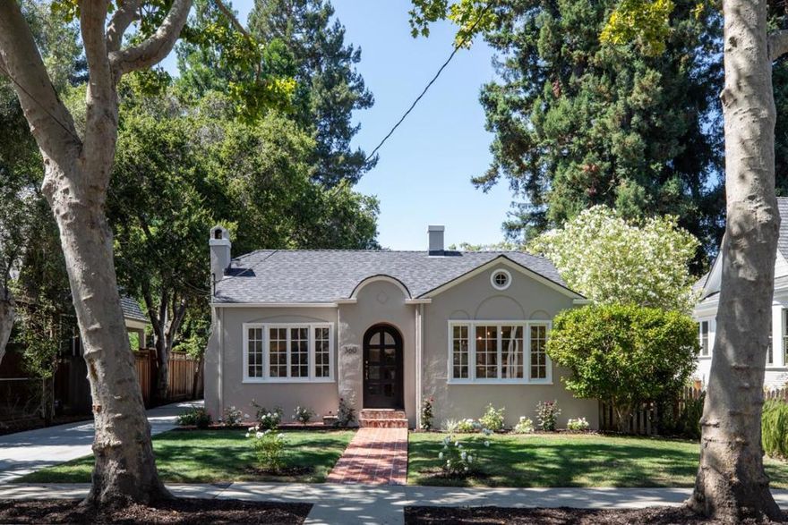 Nestled on a quiet, tree-lined street just blocks from fabulous California Ave shops and restaurants, this wonderful single level home provides 3 beds/2 baths, plus has a spacious 1 bed/1 bath 650 square foot cottage! Welcomed by a charming brick pathway leading to an arched porch and front door, the home includes beautiful hardwood flooring, a remodeled kitchen, and a plethora of windows and skylights providing an abundance of natural light. Behind the main home, the cottage is accessed by a brick pathway and includes a spacious great room with living and dining areas, full bedroom and bath, built-in cabinetry, and hardwood floors. Beautiful grounds with lush lawns, brick patio and pathways, and mature trees provide a serene setting. Detached 2 car garage plus extended driveway for ample parking. Great location near shops/dining, Caltrain, easy access to highways 101 & 280, plus outstanding Palo Alto schools!