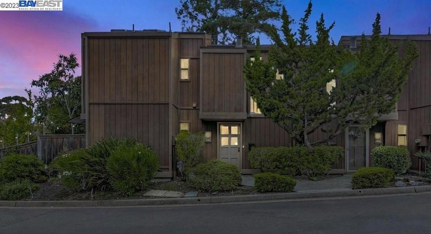 Beautiful updated 3bd/2.5ba townhome nestled in a quiet and remote wood setting of Hayward Hills. This Tahoe-like one of a kind corner unit is southwest facing and has tons of natural sunlight. It comes with 3 ensuite bedrooms, a detached 2 car garage with EV charger, a private secret garden, and a bonus enclosed sun room overlooking giant redwood trees and views of friendly wildlife passing by. The main level comes with designer parquet hardwood floors throughout, new paint, a cozy fireplace with a designated reading nook, updated kitchen, modern CB2 lighting fixture, wrap around pantry/storage under the stairs, coat closet, spacious light-filled sunroom, and a bedroom with updated half bath. Gorgeous open staircase with high ceiling and beautiful tall windows. The 2nd level comes with 2 bedroom suites, new paint, updated bathrooms, separate laundry room, master bedroom has walk-in closet, modern CB2 lighting fixture, light sconces, soaking tub and linen closet. Amenities include pool, clubhouse, tennis court, basketball hoop, and walking trails. Close to Cal State East Bay, Sulfur Creek, schools, downtown shops and restaurants, Trader Joe's, BART, Castro Valley and more.