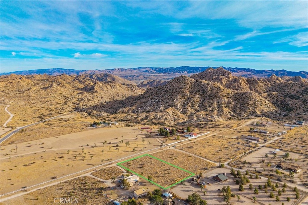 Discover an extraordinary opportunity to own in the heart of Pioneertown. These 1.25 acre, buildable lot comes with a paid water meter are situated just a short walk from the iconic Pappy & Harriet's and other historic sites, offering both convenience and charm. Surrounded by stunning natural landscapes, the property provides an ideal setting for building your dream home with breathtaking views of rugged desert mountains. Whether you're looking for a tranquil escape or a vibrant spot near Pioneertown's lively cultural hub, this parcel of land is a rare gem waiting to be transformed into something truly special. Don’t miss your chance to own a piece of this iconic desert sanctuary! Adjoining lot available as well, parcel #0594201590000