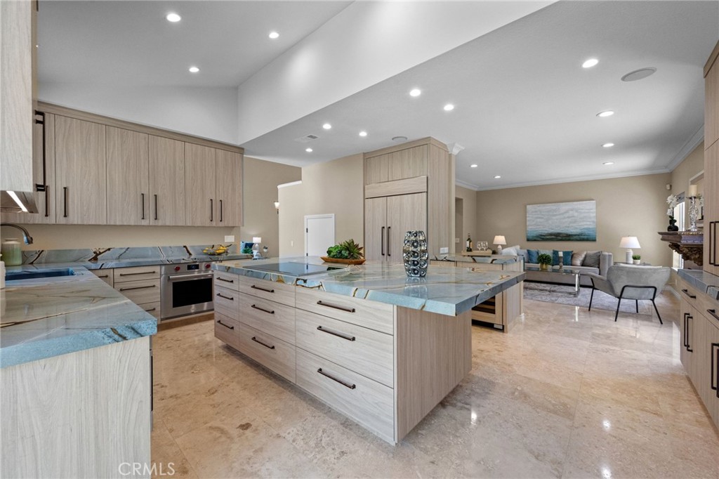 A fantastic opportunity to live the South OC coastal lifestyle in the very sought-after Westerlies neighborhood. This 4 bedroom, 3 bath luxury home features a long list of desirable upgrades. Enter thru the front door and the first thing to catch your eye is all the natural light streaming thru the abundant windows. Step onto the professionally polished travertine floors and feast your eyes on the recently renovated designer kitchen. This kitchen is an entertainer's & chef's masterpiece! The captivating quartzite counters and custom cabinetry are very upscale and inviting. The top of the line appliances include a Wolf stovetop, Wolf oven & microwave, custom Sub-Zero refrigerator, Sub-Zero wine fridge and separate U-Line high capacity ice maker! The separate pantry space and 80” Sony TV add even more WOW factor! Special attention was also spent on having plenty of recessed ceiling lighting as well as under-cabinet lighting – all controlled by deluxe dimmer switches. The living & dining areas feature expansive vaulted ceilings and views to the back yard. There is a downstairs office/bedroom and a remodeled bathroom with shower. The upstairs feature new flooring including the stairway, hallway and all bedrooms. There is a generously sized primary bedroom with a walk-in closet plus two secondary bedrooms with a jack-and-jill style bathroom. There are plenty of linen cabinets in the upstairs hallway. All the upstairs bedrooms have recessed lighting and ceiling fans. Wander outside and enjoy the beautifully renovated landscaping that includes brand NEW high quality Tiger Turf synthetic lawn, flowers, palms, a lemon tree, a newer $10k above-ground spa and plenty of landscape lighting. The backyard pergola area with lighted chandelier is the perfect outdoor space to enjoy a meal or after-meal entertaining! The original A/C & heating equipment has been replaced, the garage doors are new and the garage openers have been replaced with whisper-quiet models. The 3-car garage is move-in ready with newer epoxy flooring installed and plenty of storage cabinets and hanging storage ready to be used! There is a premium whole-house water filtration system installed. Down the street is a greenbelt and easy trails for walking a furry family member. Shopping, dining, The Ritz Carlton, Dana Point Harbor and Laguna Beach are all just minutes away. Turn key and hundreds of thousands spent! Act quickly – this beautiful Laguna Niguel home is ready to be a part of YOUR lifestyle!