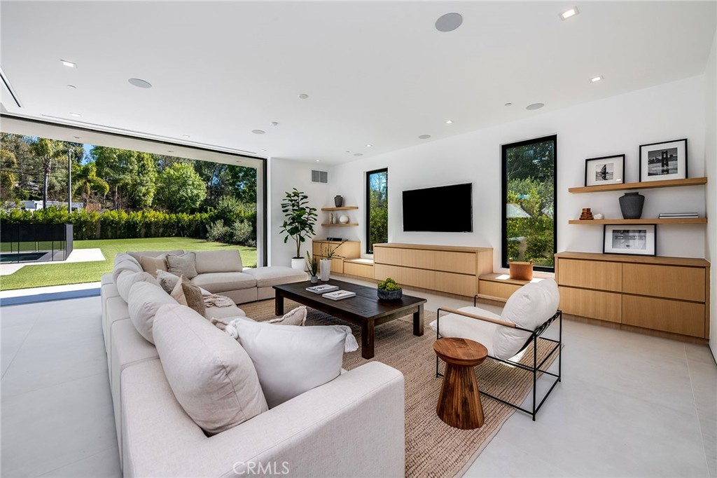 Gorgeous 8000 ft.² Sprawling Modern New construction home South of Boulevard!
Fully furnished, this home is truly a showstopper!!! Fully gated and secure, this signature home is located on a lovely peaceful street in Tarzana. This home has the WOW! The stunning entry introduces the modern elegance resonates through the space, greeted by wall of glass opening up to the drive expansive backyard.
With soaring ceilings and large living spaces, this home is Engineered for entertaining and family gathering. The kitchen is the refined and spacious anchor, facing a gorgeous 10 seat dining table. Sink into the expansive casual family room that opens into covered back patio, or choose the most intimate bar area to entertain, lounge and relax. All the bedrooms outfitted with king size beds, including the downstairs guest, which afford privacy and convenience. Upstairs you will find a designated comfortable workspace with adjoining balcony and seating area, a luxurious primary suite with 2 walk in closets and wrap around balcony. All the secondary bedrooms are large beautifully appointed, with walk-in closets.
The backyard and pool area provides a variety of different lounging areas and dining alfresco is a must! A gorgeous, sparkling pool and space to entertain and enjoy is priceless!
12-month lease, with short-term options open for discussion.