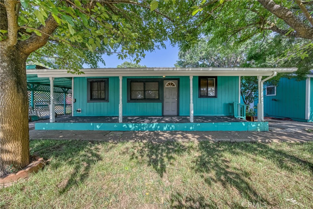 Cute little starter home or investment property on freshly paved street in the City of Clearlake. Fenced, level yard with a garage. Covered porch and cement walk-ways. There is also a carport on the other side of the yard/house. Main house is a 2 bedroom, 1(full) bathroom with laundry hook-ups in the bathroom. One of the bedrooms has a slider leading to yard. The living room has 2 ceiling fans, swamp cooler and pellet stove. Laminate flooring throughout. Kitchen features dual sink, and a pantry room. The garage has a studio/room attached to it with a 3/4 bathroom featuring a walk-in shower. This property is on city water and sewer, plus has a well for irrigation that has to be plugged in. Be in Napa in about a hour, I5 a hour or HWY 101 a hour.