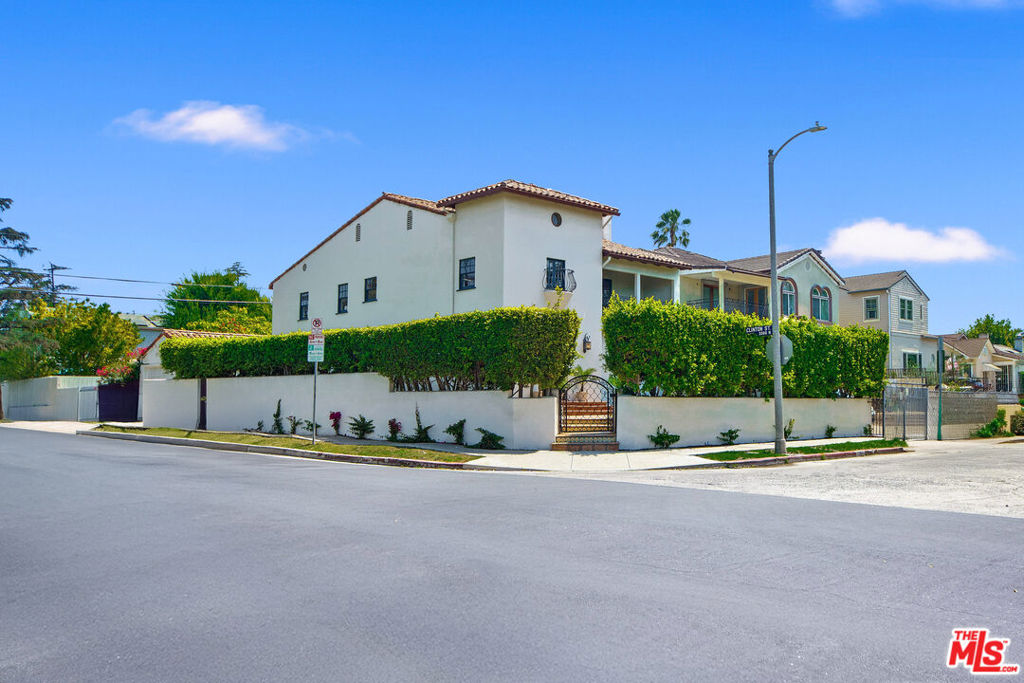 Grace, character, and craftsmanship come together beautifully in this exceptional Spanish Revival home, ideally positioned on a corner lot, and in close proximity to the coveted Larchmont Village. Offering over 3,100 sq ft of thoughtfully designed living space, this 5 bedroom, 4 bathroom residence blends timeless architecture with modern-day comfort. Rich period details and curated finishes throughout speak to the home's enduring charm and quality, from the double pantry, hardwood floors throughout, custom millwork, to the arched doorways. The generously sized bedrooms provide space, comfort and flexibility while the large finished attic offers over 1,000 sq ft of additional space with endless possibilities. A rare opportunity in one of the most desirable and beloved neighborhoods in all of Los Angeles.