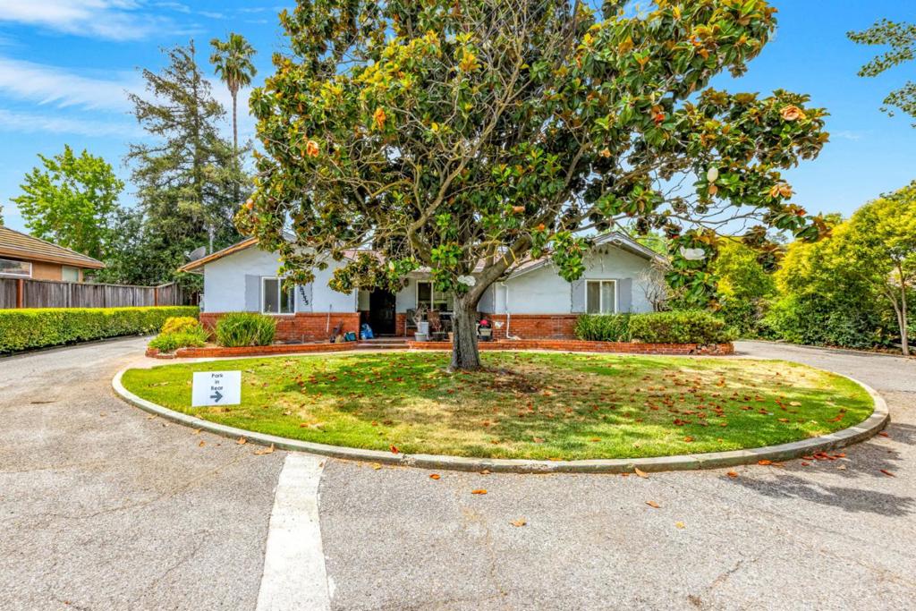 Charming 4-Bed, 2-Bath Home with Prime Development Potential in Morgan Hill Discover this inviting 4-bedroom, 2-bathroom home set on over an acre of prime land in the heart of Morgan Hill, offering both comfort and endless possibilities. The property features a spacious layout, complemented by valuable outbuildings, including a shop and storage shed, perfect for hobbyists or extra storage. This property is ideal for creating a private family compound, bringing your kids, and building multiple homes! Once you cross the creek over your private bridge, you'll enter a secluded, serene area perfect for crafting your family's dream retreat. The land is zoned for 4-6 single-family homes or, under the new law effective July 1, 2025, up to 10 condos, making it a fantastic opportunity for investors, developers, or builders. At just $170,000 per lot for condos, this is a rare chance to capitalize on Morgan Hills' thriving market. Conveniently located within an easy walk of vibrant downtown Morgan Hill, enjoy fine dining, boutique shopping, and community events like the annual Fourth of July parade. Whether you're envisioning a family compound or a lucrative development project, this property in one of California's most desirable communities is a must-see! The property is over one acre.