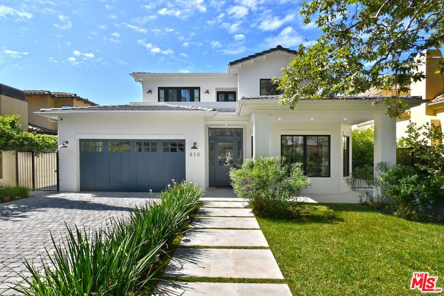 This Elegant Contemporary Traditional home is move in ready, as in, all you need to bring is your toothbrush! Located on a quiet and beautiful, tree lined street north of Montana Avenue in prime Santa Monica, this coveted home is filled with natural light, featuring soaring 10 foot ceilings and large windows, letting the sun shine in. The seamless indoor-outdoor flow creates an ideal setting for living and entertaining, with a sparkling pool and spa, waterfall, grassy area, built in BBQ and outdoor heaters to enjoy the peaceful and private backyard year round. The kitchen, a gourmet chef's delight, features marble countertops, an expansive island, double ovens, and top-of-the-line appliances.  6 Bedrooms, 8 bathrooms are ample room for the whole family- the primary suite showcasing vaulted ceilings, a cozy fireplace and french doors leading to a terrace. A whole home theater, gym, wine cellar and in-law suite compliment the open and light basement, which is accessible from the elevator accessing all 3 floors. Home was purchased brand new, and the owners put in all of the finishing touches- custom window treatments, designer runners, venetian plaster, lush landscaping, Savant whole home automation system with security cameras, automated gate and pedestrian gate, etc etc. Option for the perfect buyer to buy the home furnished. Welcome to 416 21st Place, truly a blend of luxury, comfort and sophistication!