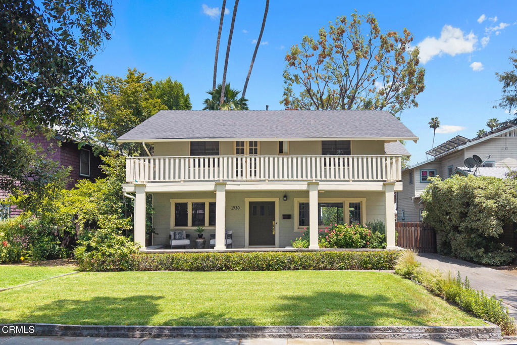 Situated on a picturesque street in South Pasadena's coveted Marengo District, this elegant Monterey Revival home offers timeless character, generous living spaces, and beautifully landscaped outdoor areas. A wide, covered front porch welcomes you into a home rich with charm and character. Inside, the expansive living room showcases a stunning box-beamed ceiling and a stately fireplace, creating a warm and inviting atmosphere. A pocket door leads to a formal dining room--perfect for entertaining or easily repurposed as a private home office. Toward the back of the home, the open-concept family/dining area flows seamlessly into the galley kitchen, all overlooking the vibrant, playful backyard through large sliding glass doors. The lower level includes a dedicated laundry room and a convenient powder bath. Upstairs, you'll find four generous, light-filled bedrooms, two bathrooms, and two balconies that provide tranquil spaces for morning coffee or sunset views. Out back, a gated yard offers a spacious patio for outdoor dining, a lush lawn for play or gardening, and a detached 2-car garage with additional parking space. With its thoughtful layout, architectural charm, and prime location near South Pasadena's Blue-ribbon schools, parks, and shopping.