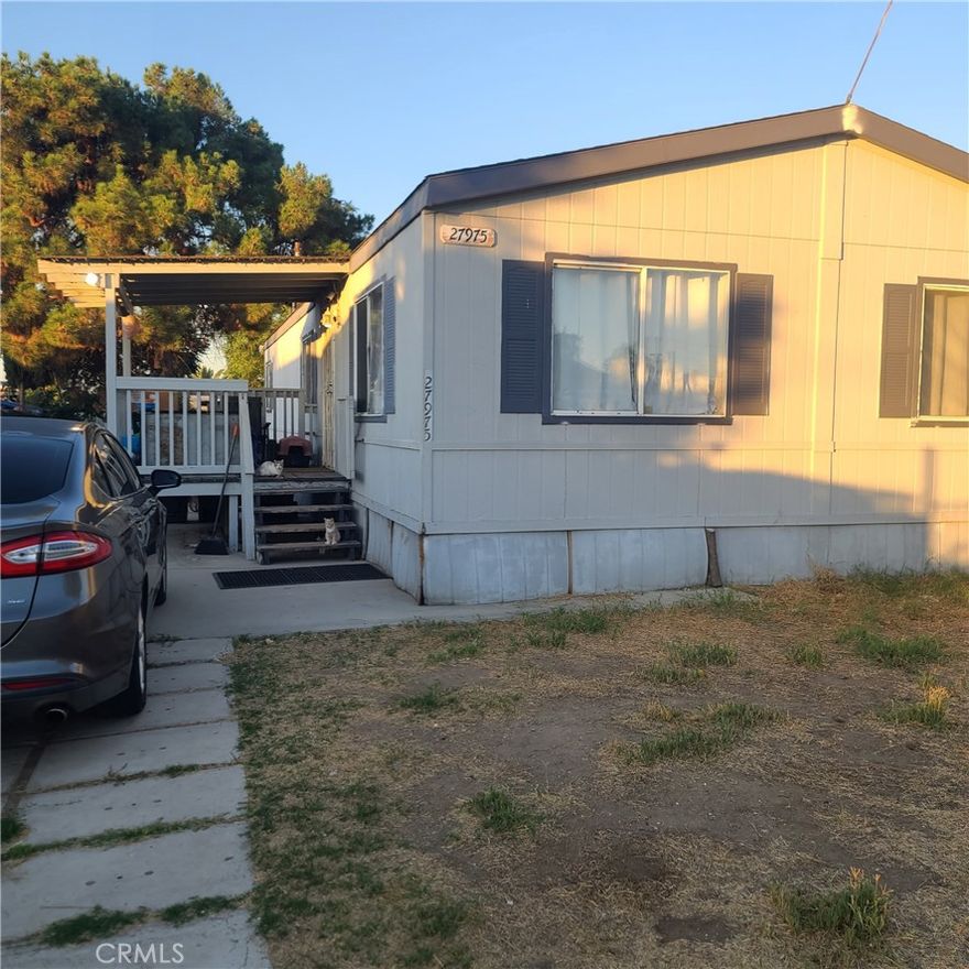 Welcome home! This charming 3-bedroom, 2-bath manufactured home (tax records show 2 bedrooms) was built in 1999 and is set on a 433 permanent foundation for peace of mind. Inside, you’ll find updated touches and beautiful LVP flooring throughout. The good-sized lot is fully usable, featuring a rolling gate for added convenience and security, plus plenty of space to build a garage or create your dream outdoor retreat. This home combines comfort, function, and community in one great package. More Pictures Coming Soon!