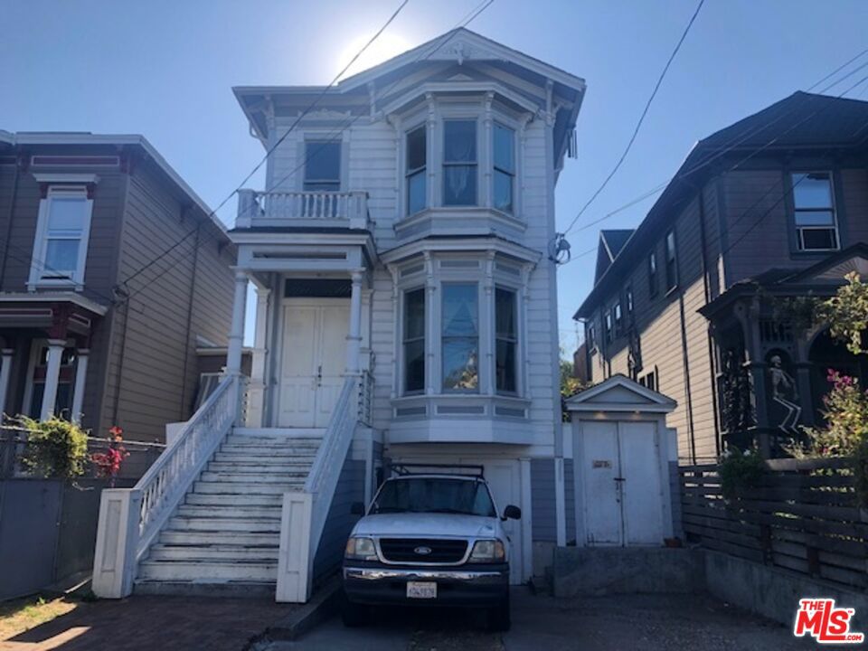 Step back in time with this beautifully preserved Victorian duplex in the heart of West Oakland. Built in 1883, this stately two-story home offers timeless architectural charm paired with modern potential. Featuring two spacious units totaling approximately 2,875 sq ft, this property includes four bedrooms and four bathrooms, providing plenty of space for multi-generational living, rental income, or a live-work setup.The classic exterior showcases period details that reflect the rich history of Oakland's early neighborhoods. Inside, you'll find high ceilings, large windows, and generous layouts ready to be reimagined with your personal touch. Situated on a 3,850 sq ft lot, the property also offers a private outdoor area perfect for a garden, patio, or future expansion.Located near BART, major freeways, and the vibrant restaurants and shops of West Oakland and Downtown, this home combines convenience with character. Whether you're looking to invest, restore, or occupy, 1032 Peralta Street presents a rare opportunity to own a piece of Oakland's history while creating a bright future.