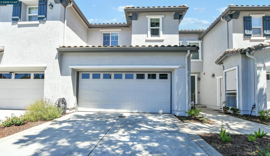Location is everything! This beautifully maintained 3-bedroom, 3-bathroom townhome is located in the highly desirable gated Copper Gate community of Brentwood. Offering approximately 1,483 sqft of comfortable living space, this home is situated near the end of a quiet lane and features a full-sized driveway, an uncommon find in the community. Inside, you'll find a bright and welcoming layout with stylish laminate flooring throughout. There is a half bath located downstairs. All three bedrooms and two full bathrooms are upstairs, providing privacy and space. The home also features a private patio with no rear neighbors. The HOA has recently painted the outside. Enjoy the resort-style amenities of the Copper Gate HOA, including a community pool, playground, clubhouse, and greenbelt areas. Conveniently located close to shopping, schools, parks, and commuter routes.