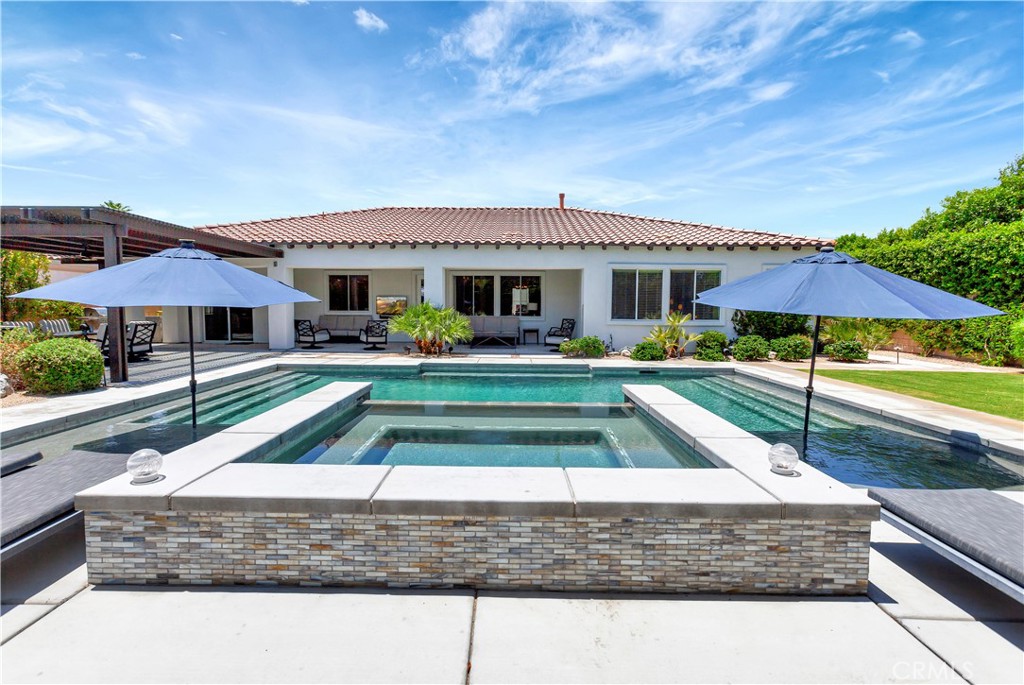 This is an absolute show stopper! FULLY FURNISHED Residence 2 plan with 6 bedrooms & 4.5 bathrooms completely upgraded. Wide plank wood tile flooring flowing into the open concept living space. Quartz and Granite counters, upgraded cabinets, 5 1/2 inch baseboards, built in fireplace, 8ft doors, and 10ft ceilings. Casita excellent for additional family or to rent out separately. Amazing air conditioned garage converted into a game room with flooring, built in refrigerator, foosball, shuffle puck, & pool table etc... This home has it all! Don't overlook the incredible private backyard perfect for entertaining. Features include newer pool & spa, Pergola covered patio, fire pit, & $10,000 worth of Sonos speakers. Orchard is approved for 5 short term rentals per year during the festivals. Perfect for a primary or secondary home with the ability to rent during festival season.